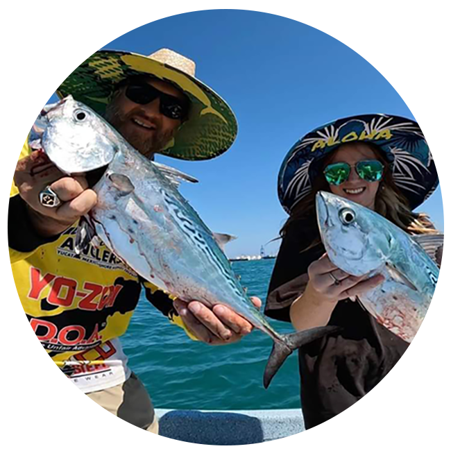 chris and client holding fish on tour